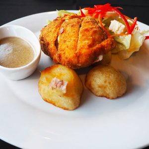 Chicken cordon bleu with roast potatoes and salad