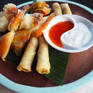 Starter of spring rolls and tempura prawns