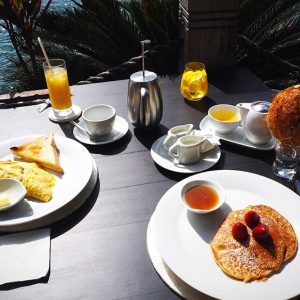 Pancakes and scrambled egg with toast for breakfast