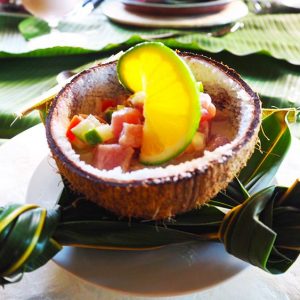 Raw fish in coconut cream, chopped onion and cucumber