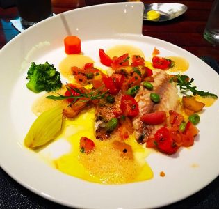 Grilled red snapper, cherry tomatoes, saffron potatoes, garlic lemon butter
