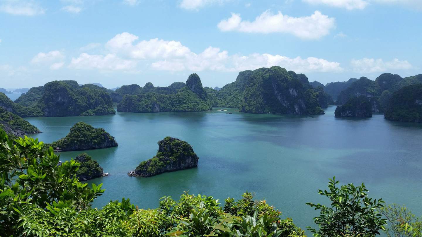 Exploring Halong Bay in a Luxury Junk, Vietnam – WhodoIdo: Floating on emerald waters, cruising past thousands of limestone islands in Halong Bay in a Junk.