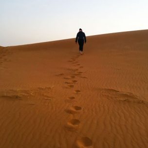 Walking up the dunes early in the morning