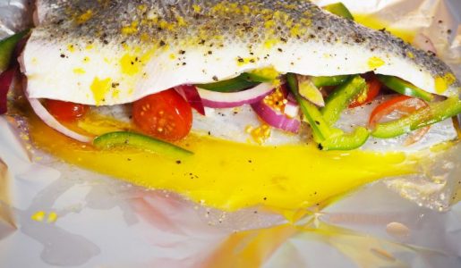 Sea Bass fillets with onion, tomatoes, peppers
